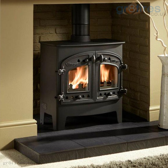 What does the heat output of a wood-burning stove mean